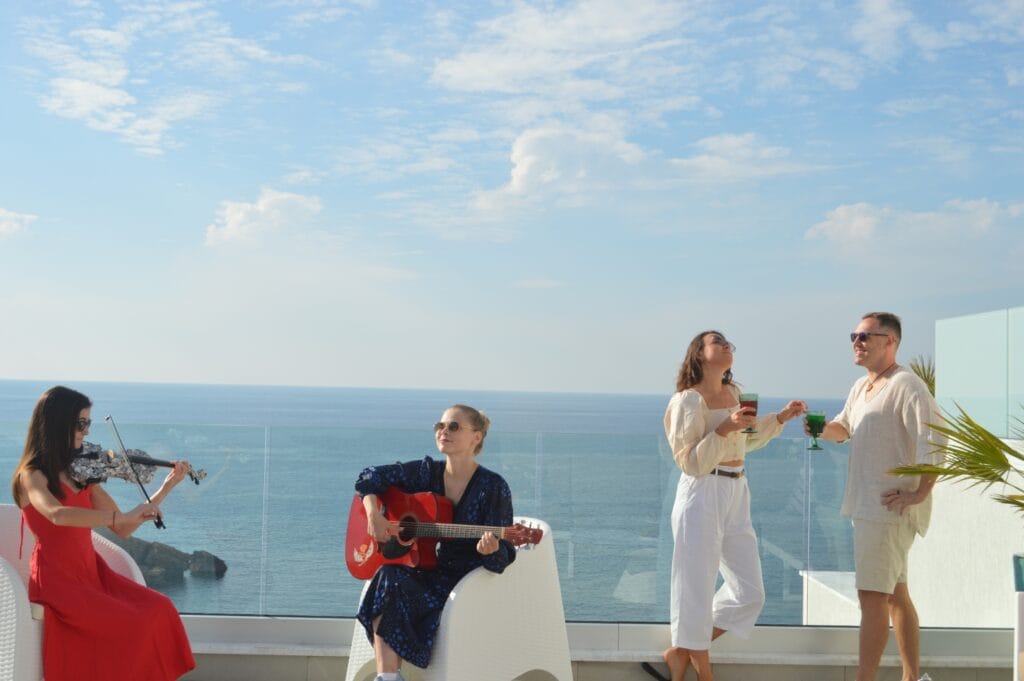 Soft live music performance for a celebrating couple on the rooftop of the Olymp Luxury House